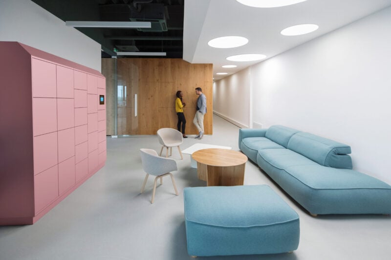 Two Business People Talking In A Lobby