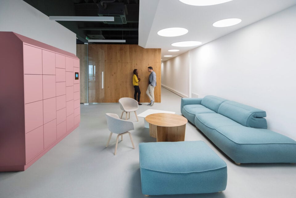 Two Business People Talking In A Lobby